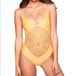 Frankie’s bright yellow one piece